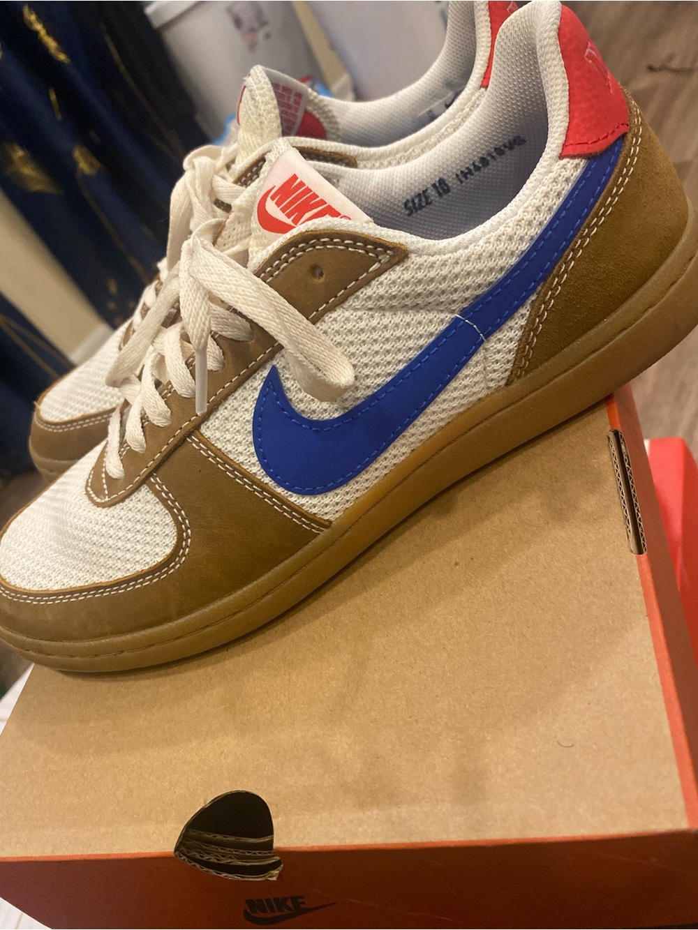 Nike Cream and Blue Low-Top Sneakers with Brown Overlays and Red Heel